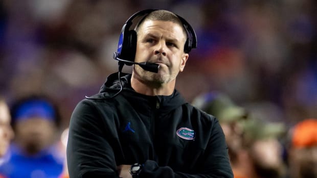 Florida coach Billy Napier with his arms crossed